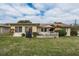 Home's exterior, highlighting the backyard and patio at 102 Stafford Dr, Palm Harbor, FL 34684
