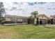 Ranch style home with a spacious lawn and two-car garage at 102 Stafford Dr, Palm Harbor, FL 34684