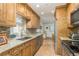 Bright kitchen, granite countertops, stainless steel appliances, and wood cabinets at 102 Stafford Dr, Palm Harbor, FL 34684