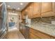 Updated kitchen boasting stainless steel appliances and wood cabinets at 102 Stafford Dr, Palm Harbor, FL 34684