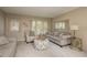 Living room with a neutral color palette, comfy seating, and ample natural light at 102 Stafford Dr, Palm Harbor, FL 34684