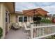 Private patio featuring seating area and white fence at 102 Stafford Dr, Palm Harbor, FL 34684