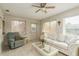 Relaxing sunroom with comfy seating and lots of natural light at 102 Stafford Dr, Palm Harbor, FL 34684