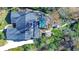 Aerial view showcasing home, pool, and lush backyard at 105 Locust Dr, Brandon, FL 33511