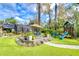 Large backyard with deck, playset, and artificial turf at 105 Locust Dr, Brandon, FL 33511