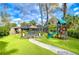 Large backyard with playset and lush landscaping at 105 Locust Dr, Brandon, FL 33511