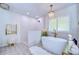Spa-like bathroom with a large soaking tub and walk-in shower at 105 Locust Dr, Brandon, FL 33511