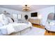 Comfortable bedroom with a large TV, plenty of storage and natural light at 105 Locust Dr, Brandon, FL 33511