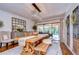 Bright dining room with large wooden table and view to pool at 105 Locust Dr, Brandon, FL 33511