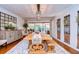 Bright dining room with large wooden table and view to pool at 105 Locust Dr, Brandon, FL 33511