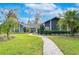 Beautiful home exterior with landscaped yard and walkway at 105 Locust Dr, Brandon, FL 33511