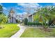 Landscaped exterior of home with brick walkway at 105 Locust Dr, Brandon, FL 33511