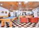 Game room features pool table, seating, and wet bar at 105 Locust Dr, Brandon, FL 33511
