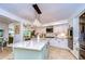 Eat-in kitchen with large island, granite countertops, and ample cabinet space at 105 Locust Dr, Brandon, FL 33511