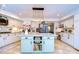 Spacious kitchen featuring a light green island and granite countertops at 105 Locust Dr, Brandon, FL 33511