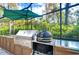 Stainless steel grill and built-in outdoor kitchen at 105 Locust Dr, Brandon, FL 33511