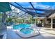 Relaxing screened pool and spa with patio furniture at 105 Locust Dr, Brandon, FL 33511