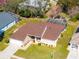Aerial view showing home's layout and spacious backyard at 1066 Larkin Rd, Spring Hill, FL 34608