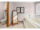 Bathroom with soaking tub, separate shower, and tiled floor at 1066 Larkin Rd, Spring Hill, FL 34608