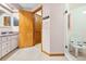 Bathroom featuring double vanity, walk-in shower, and linen closet at 1066 Larkin Rd, Spring Hill, FL 34608