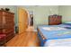 Bedroom with hardwood floors and access to a hallway at 1066 Larkin Rd, Spring Hill, FL 34608