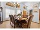 Formal dining room featuring a wood table, six chairs, and elegant chandelier at 1066 Larkin Rd, Spring Hill, FL 34608