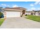 Two-car garage with a spacious driveway at 1066 Larkin Rd, Spring Hill, FL 34608