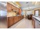 Well-equipped kitchen with wood cabinets, stainless steel appliances, and granite countertops at 1066 Larkin Rd, Spring Hill, FL 34608