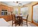 Kitchen breakfast nook with built-in seating and pool view at 1066 Larkin Rd, Spring Hill, FL 34608