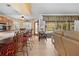 Kitchen with breakfast bar, view of pool, and sliding doors at 1066 Larkin Rd, Spring Hill, FL 34608