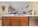 Kitchen island with sink, and views of the living area at 1066 Larkin Rd, Spring Hill, FL 34608