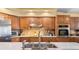 Kitchen sink and faucet with stainless steel appliances at 1066 Larkin Rd, Spring Hill, FL 34608