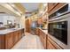 Kitchen with stainless steel appliances and wood cabinets at 1066 Larkin Rd, Spring Hill, FL 34608