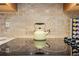 Close-up of kitchen countertop with electric cooktop and kettle at 1066 Larkin Rd, Spring Hill, FL 34608