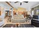 Open living room and kitchen with light-toned cabinets and island at 1066 Larkin Rd, Spring Hill, FL 34608