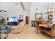 Spacious living room with vaulted ceilings, a large TV, and comfortable seating at 1066 Larkin Rd, Spring Hill, FL 34608