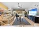 Bright living room with view of pool and kitchen at 1066 Larkin Rd, Spring Hill, FL 34608
