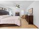 Main bedroom with king bed, dresser, and ceiling fan at 1066 Larkin Rd, Spring Hill, FL 34608