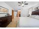 Large main bedroom with king bed and en-suite bathroom access at 1066 Larkin Rd, Spring Hill, FL 34608