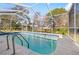 Inviting screened-in pool, perfect for relaxation at 1066 Larkin Rd, Spring Hill, FL 34608