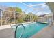 Screened-in pool with a spacious deck and backyard views at 1066 Larkin Rd, Spring Hill, FL 34608