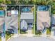 Aerial view of a house with a backyard pool at 111 Philippe Grand Ct, Safety Harbor, FL 34695