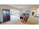 Dining area with view into sunroom and kitchen at 116 Sunrise Dr, Palm Harbor, FL 34683