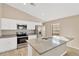 Modern kitchen featuring granite countertops and stainless steel appliances at 12403 Streambed Dr, Riverview, FL 33579