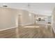 Open concept living room and kitchen with wood-look floors at 12403 Streambed Dr, Riverview, FL 33579