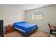 Cozy bedroom with a double bed and nightstand at 1320 Moreland Dr # 20, Clearwater, FL 33764