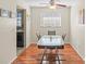 Bright dining room with glass table and hardwood floors at 1320 Moreland Dr # 20, Clearwater, FL 33764