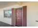 Condo front door entrance with brown door and shutters at 1320 Moreland Dr # 20, Clearwater, FL 33764