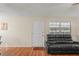 Living room with dark gray reclining furniture and hardwood floors at 1320 Moreland Dr # 20, Clearwater, FL 33764