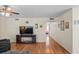Living room with hardwood floors, TV stand, and access to bedroom at 1320 Moreland Dr # 20, Clearwater, FL 33764